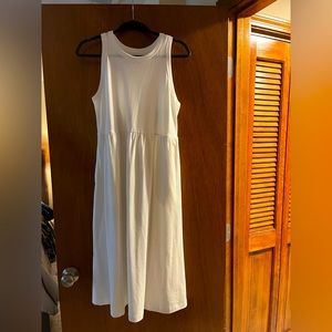 White cotton dress. Never worn. Has pockets.